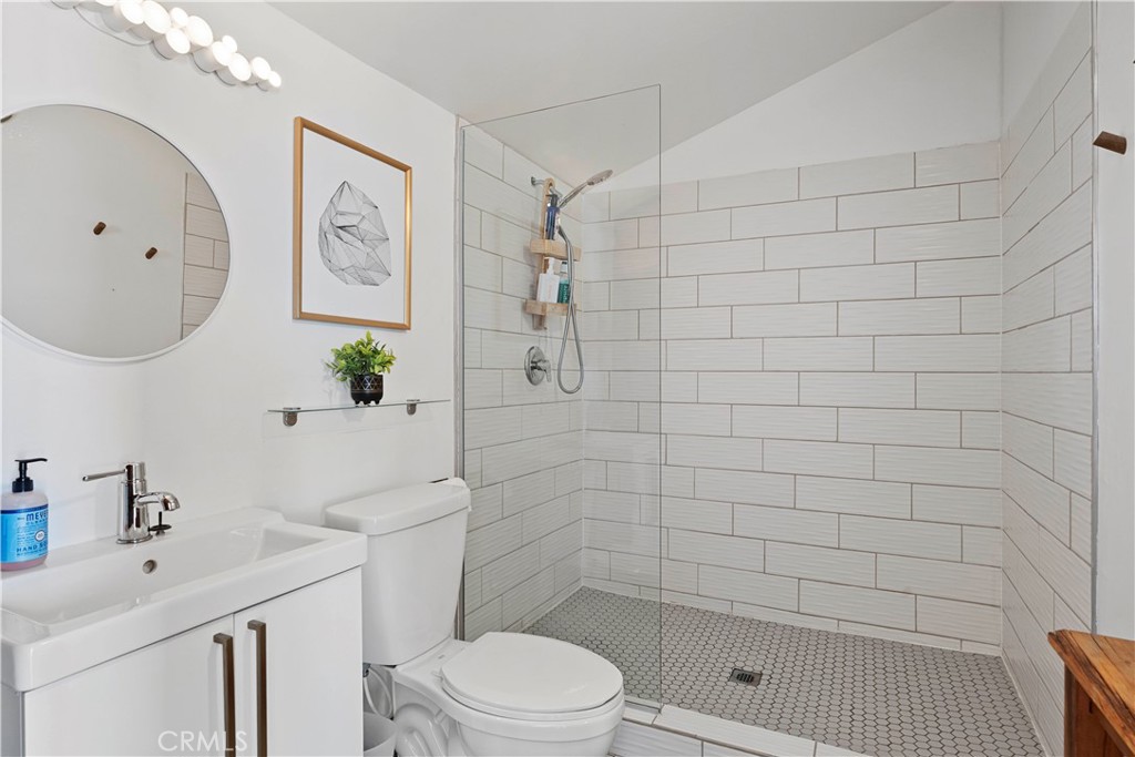 66750 Pole Line Road Joshua Tree, CA 92252 - Photo 26 of 36 a bathroom with a toilet sink and shower