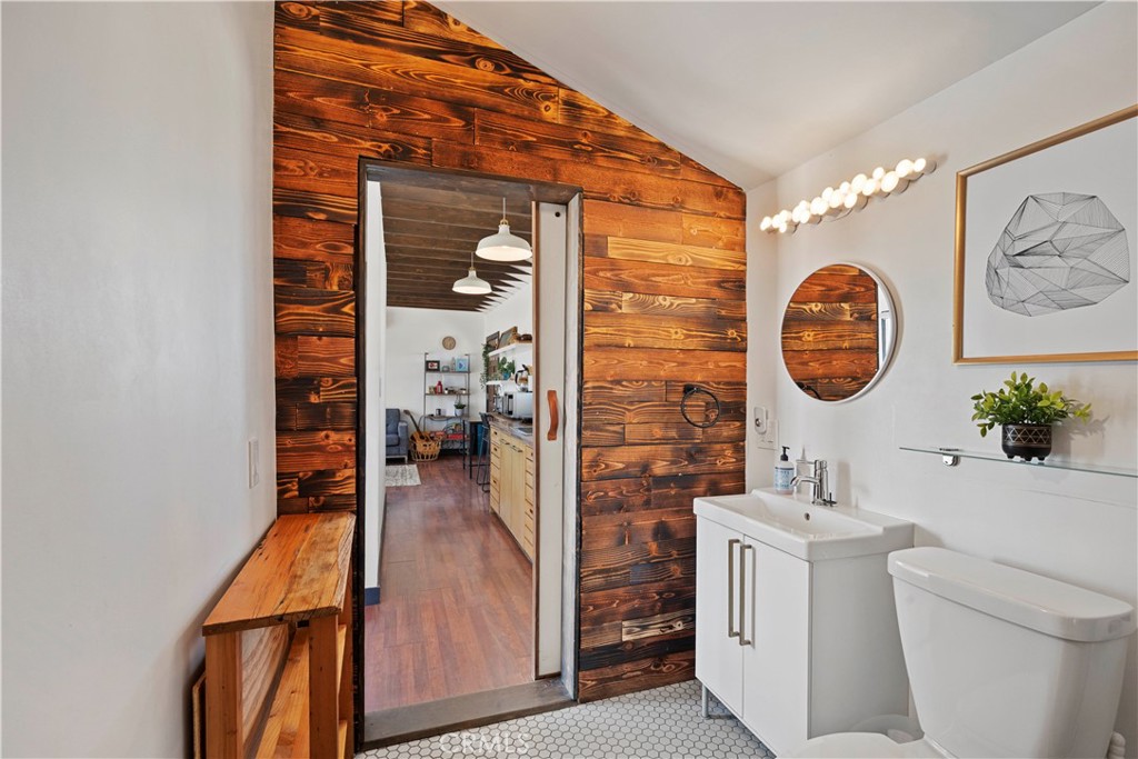 66750 Pole Line Road Joshua Tree, CA 92252 - Photo 27 of 36 a view of a hallway with washer and dryer