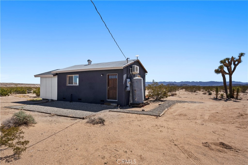 66750 Pole Line Road Joshua Tree, CA 92252 - Photo 30 of 36 a view of a house with snow on the road