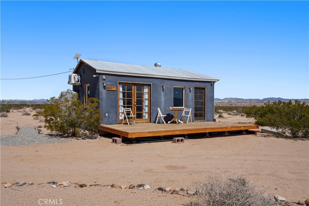 66750 Pole Line Road Joshua Tree, CA 92252 - Photo 4 of 36 a view of house with outdoor space