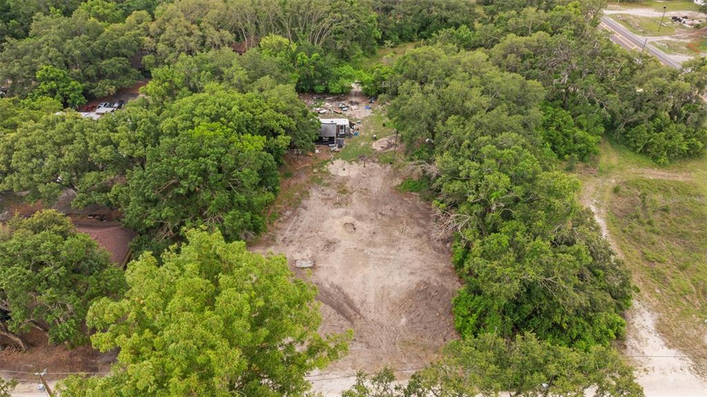 19057 Malabar Avenue Spring Hill, FL 34610 - Photo 21 of 23 an aerial view of residential house with outdoor space and trees all around