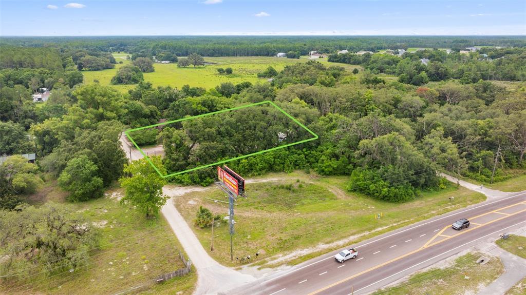 19057 Malabar Avenue Spring Hill, FL 34610 - Photo 23 of 23 a view of a swimming pool with a yard
