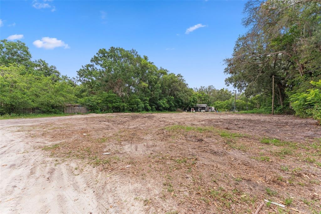 19057 Malabar Avenue Spring Hill, FL 34610 - Photo 6 of 23 a view of a field with trees in background