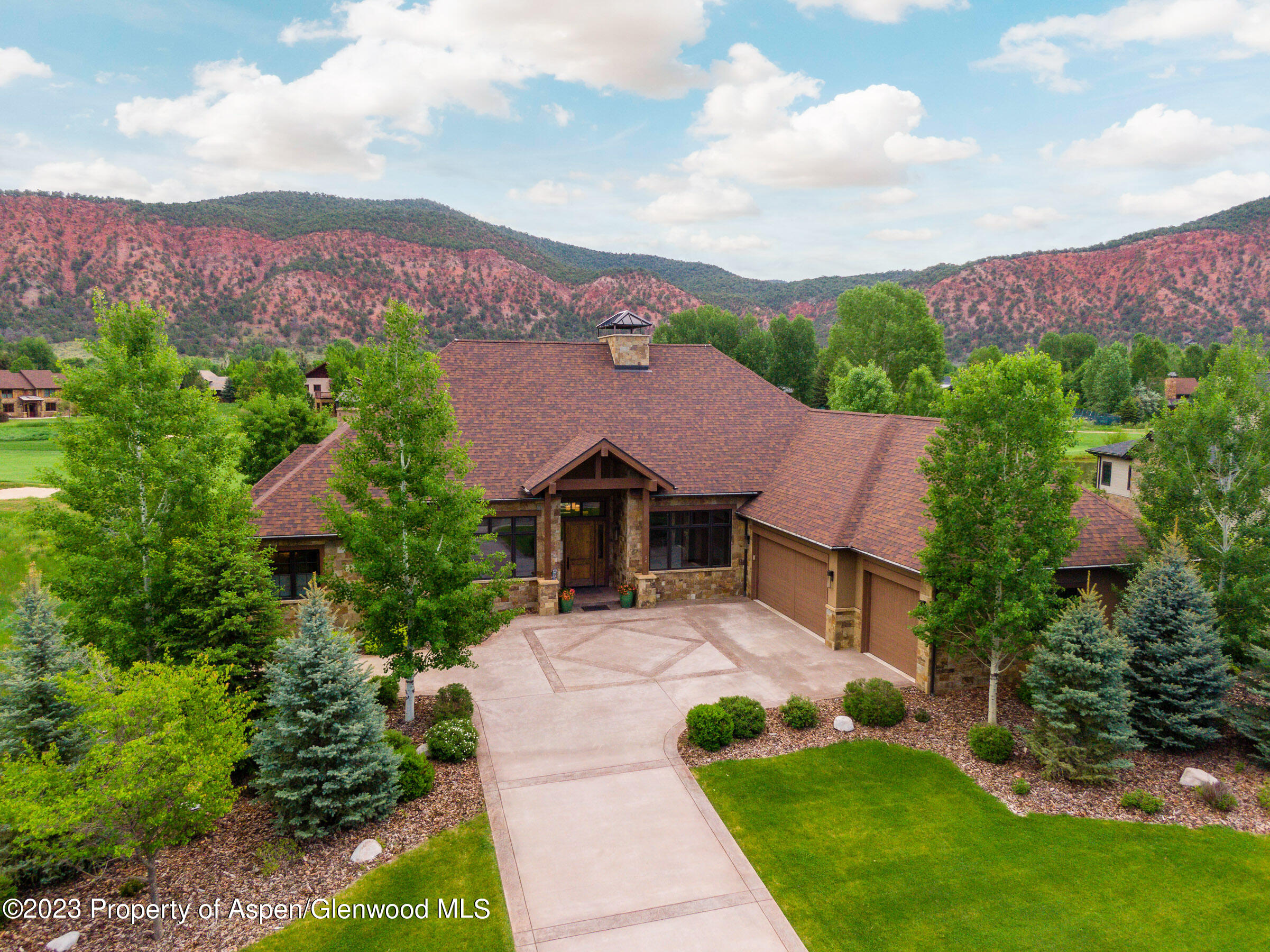 54 Kingfisher Carbondale, CO 81623 - Photo 2 of 39 a front view of a house with a yard and trees