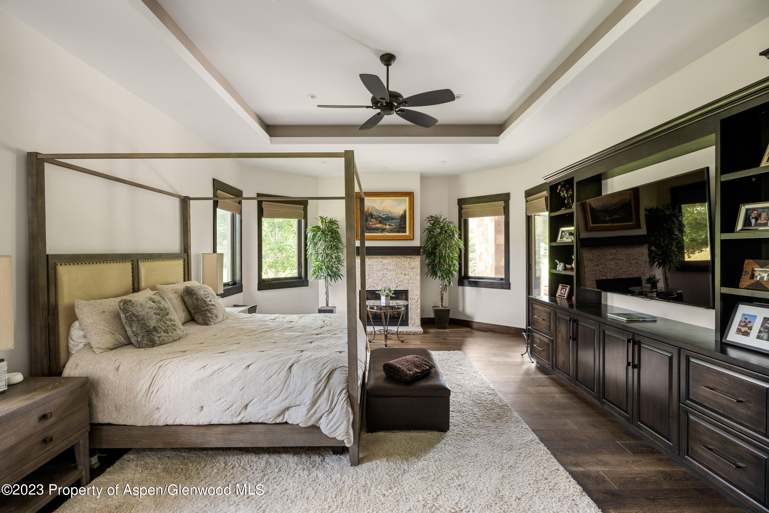 54 Kingfisher Carbondale, CO 81623 - Photo 22 of 39 a bedroom with a large bed and a flat tv screen