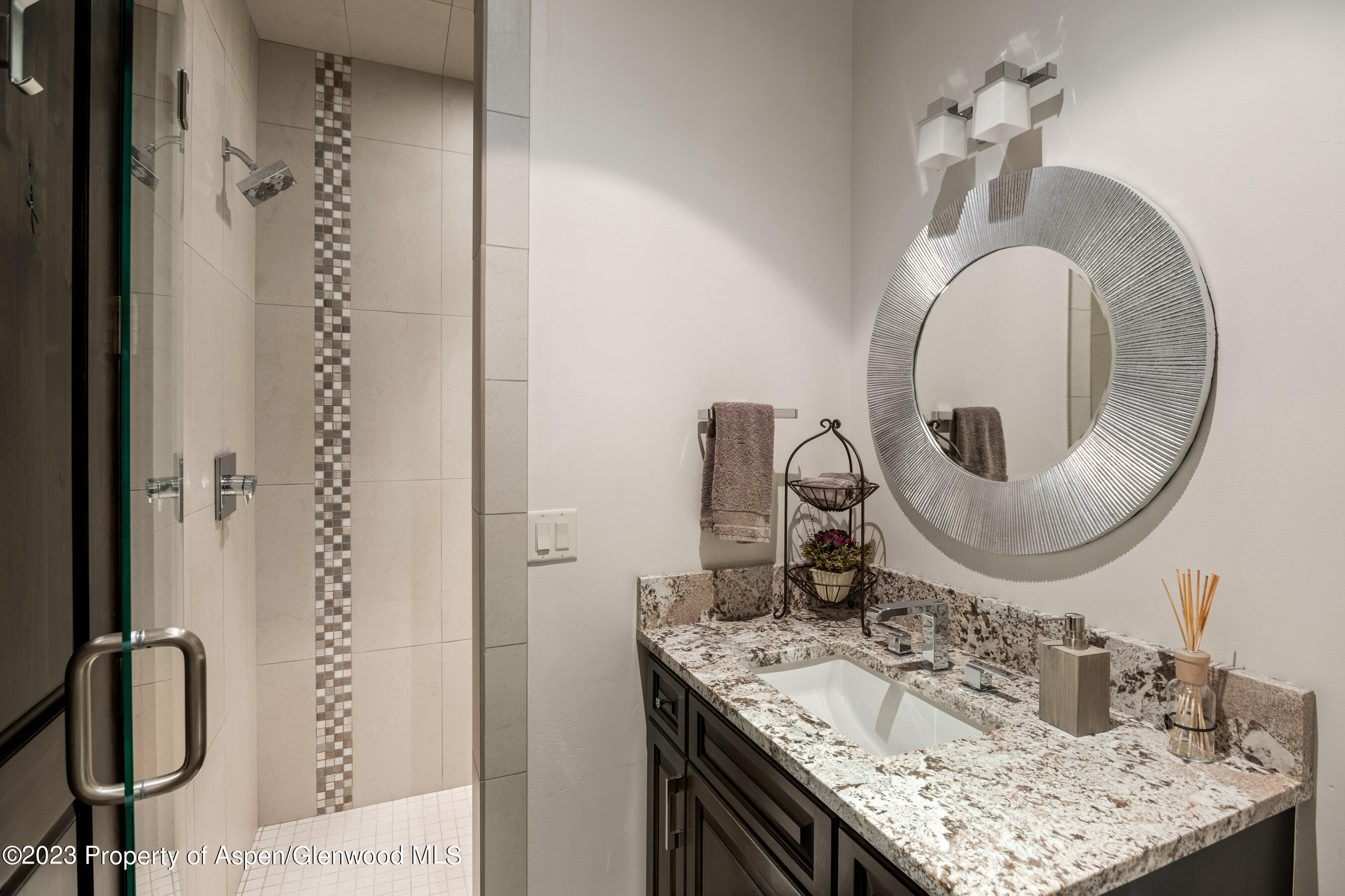 54 Kingfisher Carbondale, CO 81623 - Photo 27 of 39 a bathroom with a granite countertop sink and a mirror