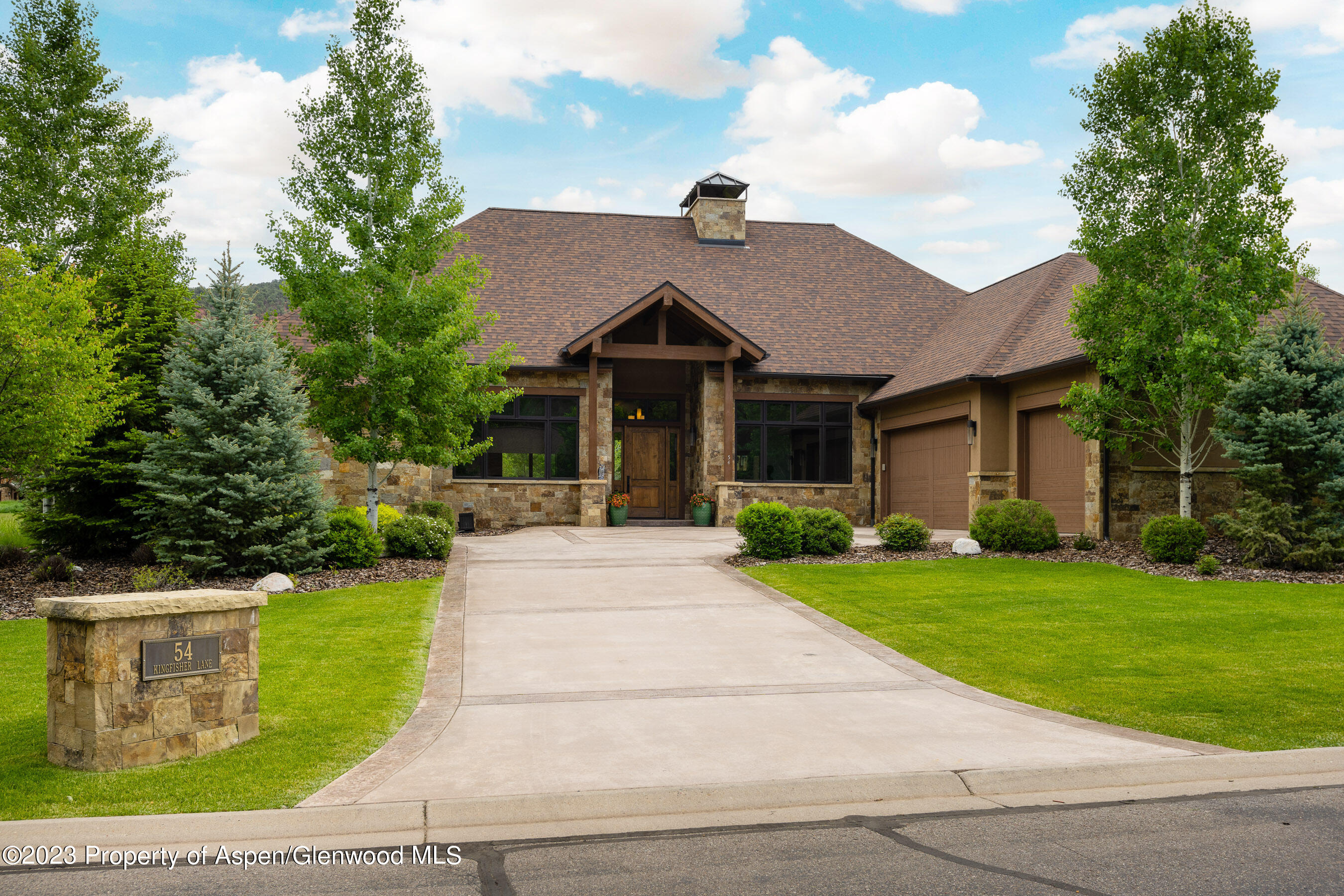 54 Kingfisher Carbondale, CO 81623 - Photo 37 of 39 a front view of a house with a yard