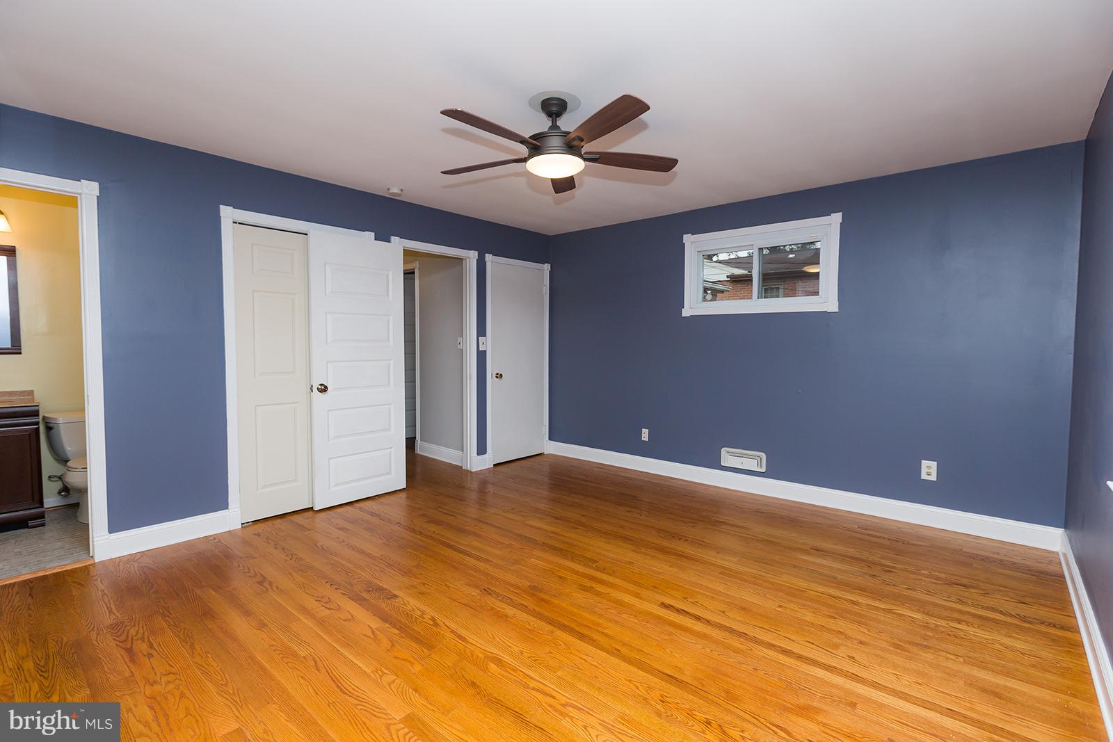 6505 Crestwood Road Baltimore, MD 21239 - Photo 17 of 26 Master bedroom with attached half bath