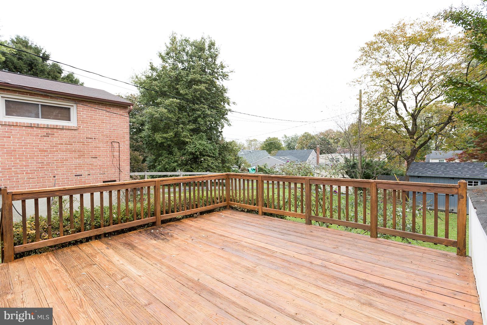6505 Crestwood Road Baltimore, MD 21239 - Photo 23 of 26 Freshly stained deck