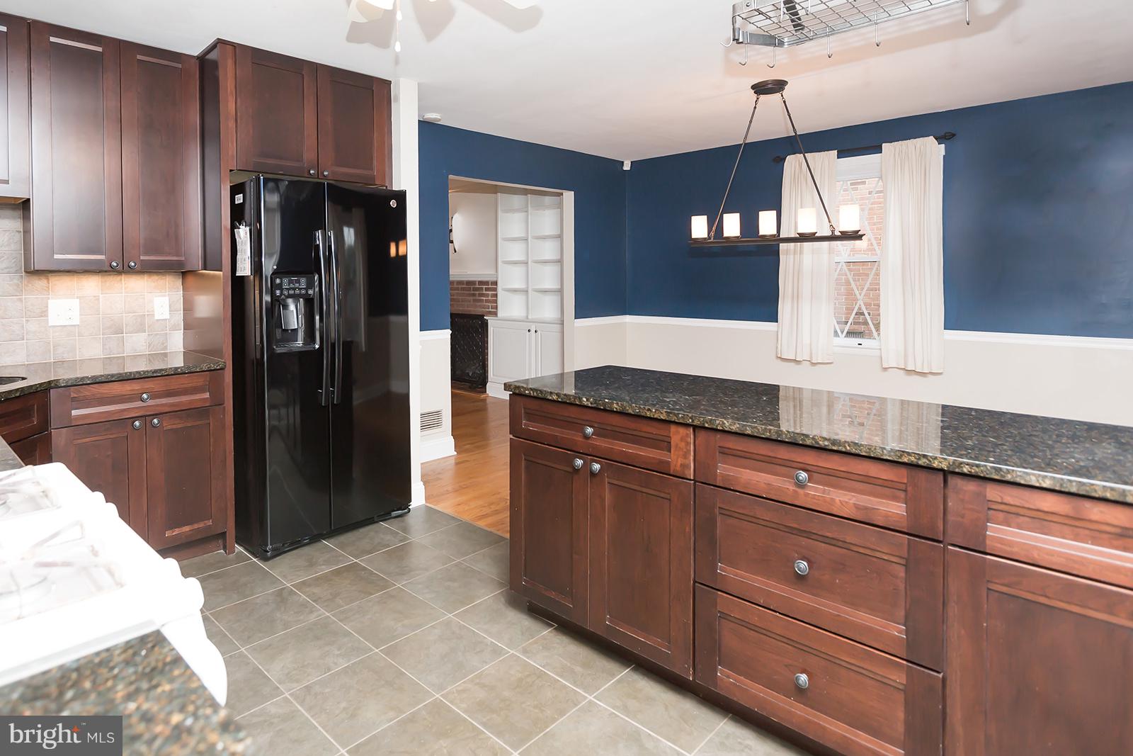 6505 Crestwood Road Baltimore, MD 21239 - Photo 6 of 26 Open kitchen with granite counters