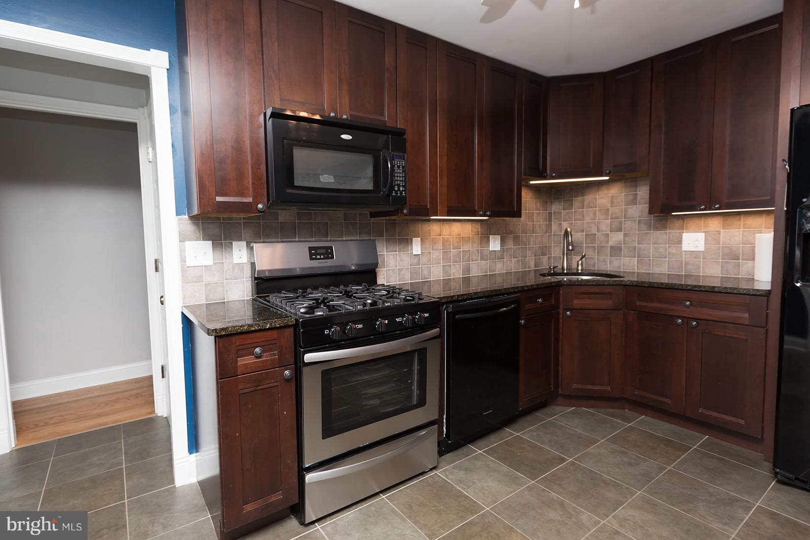 6505 Crestwood Road Baltimore, MD 21239 - Photo 9 of 26 Brand new gas range...never used!