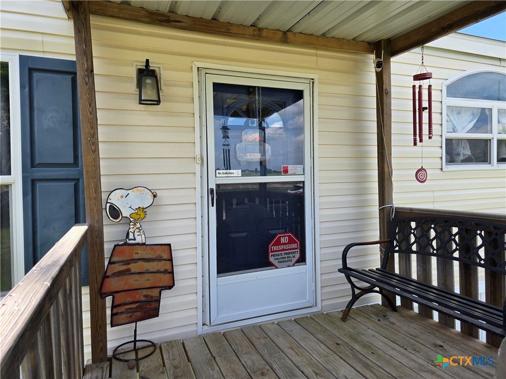 412 Coryell City Road Gatesville, TX 76528 - Photo 2 of 34 a view of a balcony with chairs and wooden floor
