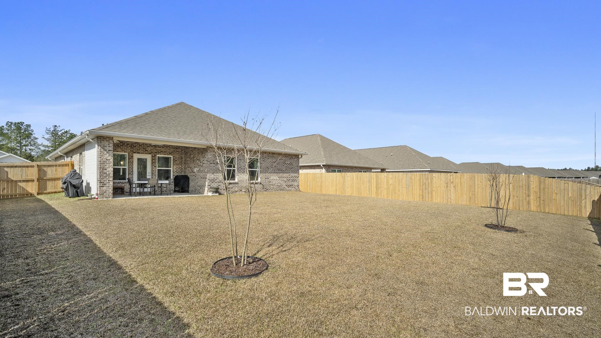 13887 Antler Hl Road Daphne, AL 36527 - Photo 26 of 50 Rear view of property with a fenced backyard, a patio area, brick siding, and a shingled roof