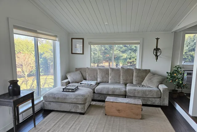 a kitchen with stainless steel appliances cabinets and a table