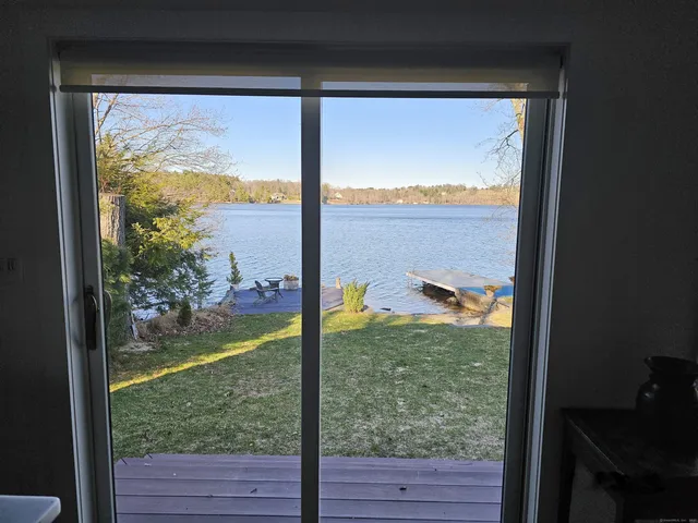 a kitchen with stainless steel appliances granite countertop a stove a sink dishwasher and a refrigerator with wooden floor