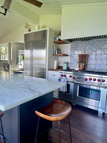 a bedroom with a bed lamp and a rug