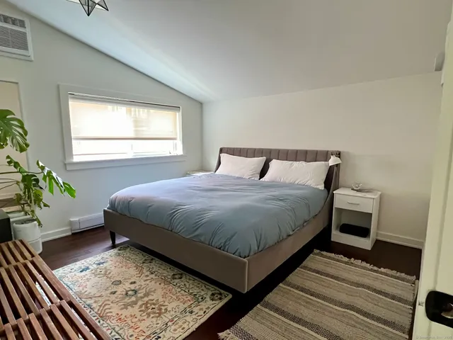 a bedroom with a bed and a closet