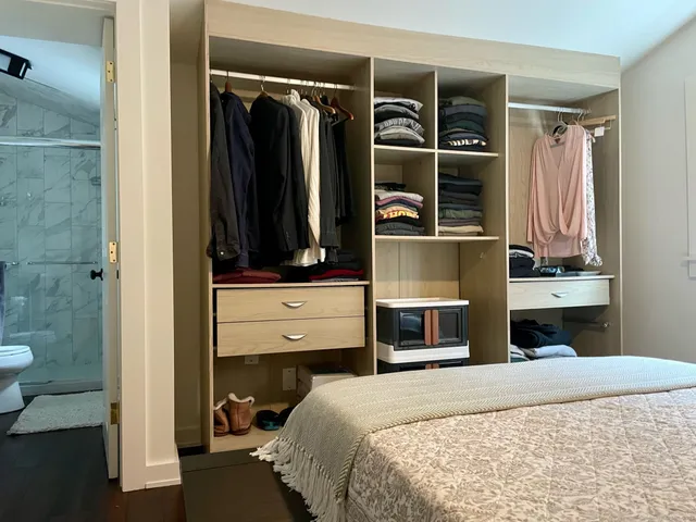 a bedroom with a bed and window