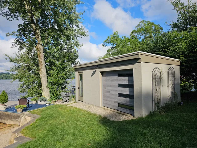 a view of a house with a backyard
