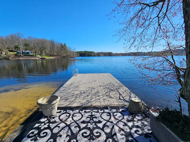 a view of a house with yard and green space