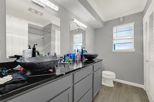 a room with sink and mirror