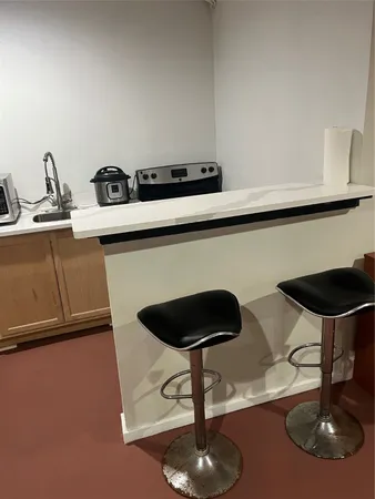 a kitchen with a table and chairs