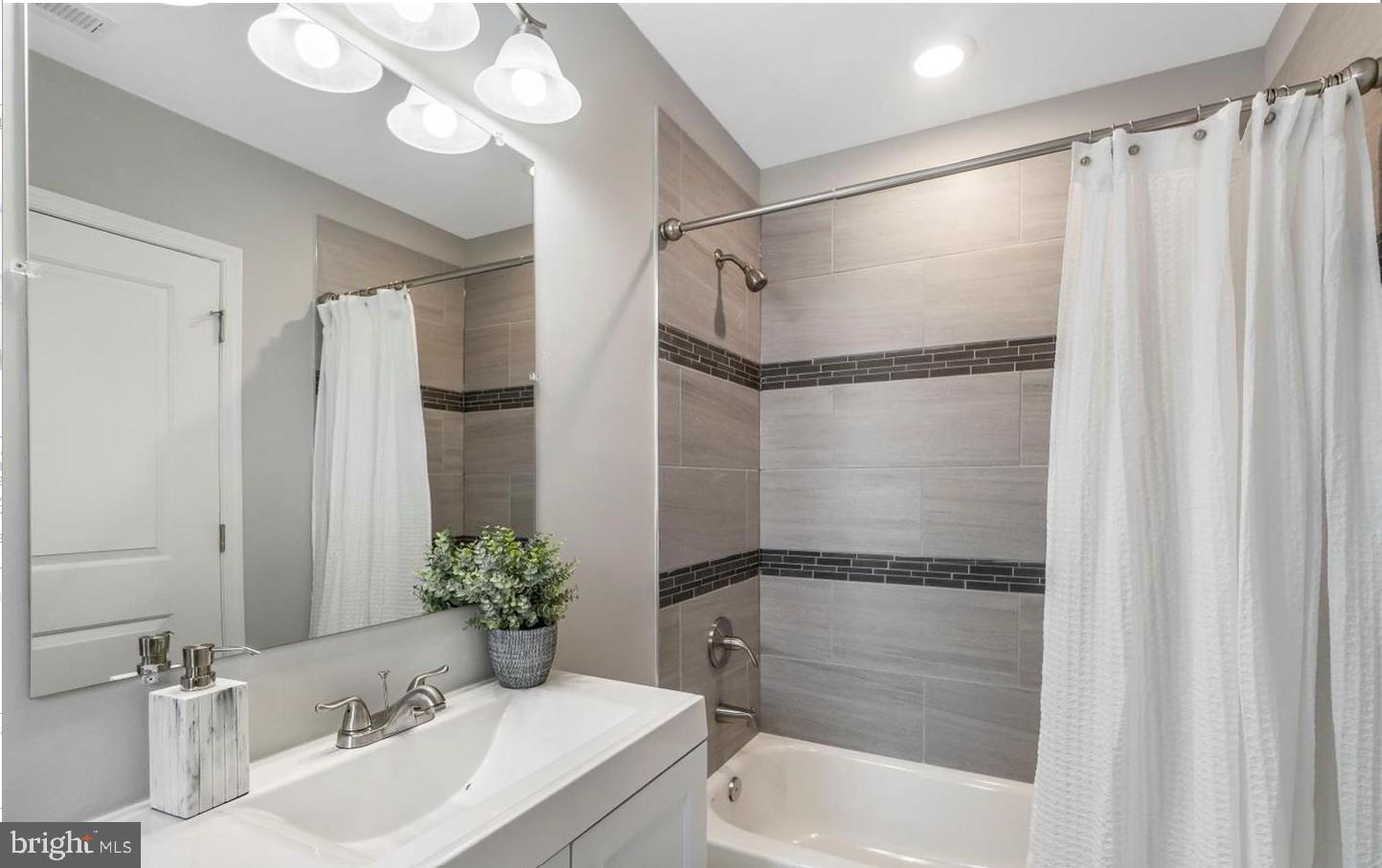 3400 Dennlyn Road Baltimore, MD 21215 - Photo 5 of 32 Sleek modern bathroom oasis.