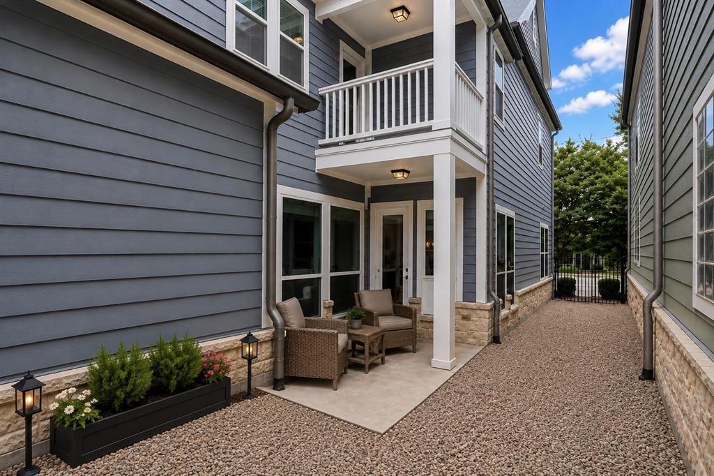773 South Coppell Road Coppell, TX 75019 - Photo 27 of 30 a view of a house with a patio and wooden fence