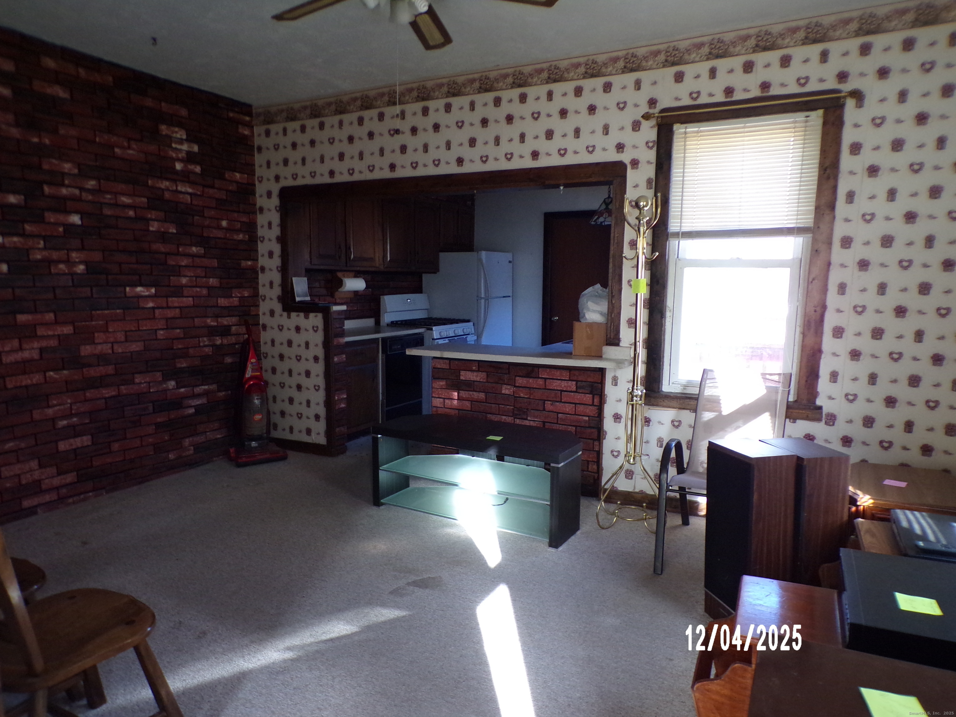 103 Myrtle Avenue Ansonia, CT 06401 - Photo 11 of 35 a room with fireplace furniture and a potted plant