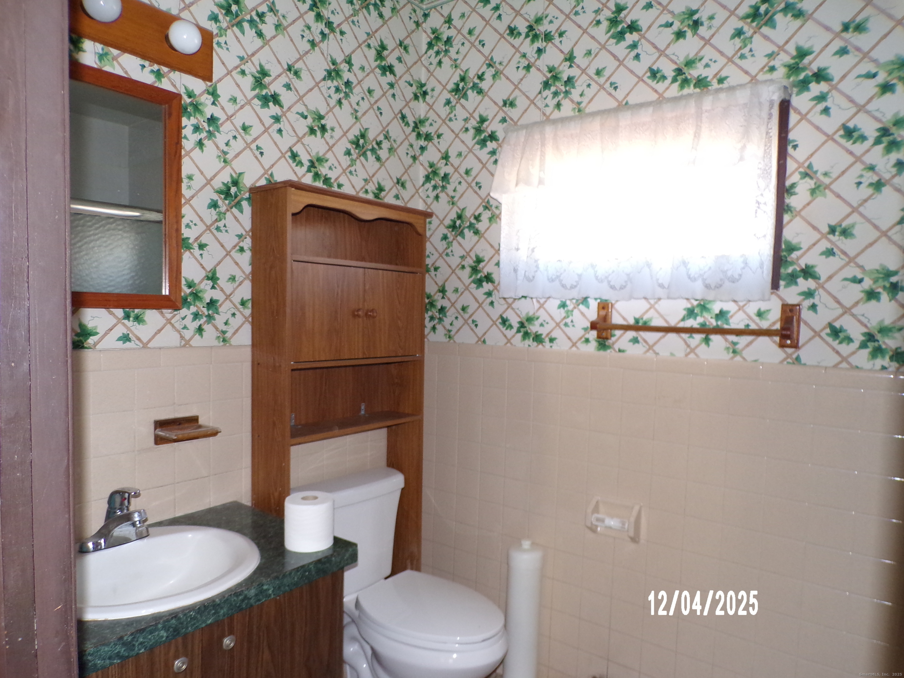 103 Myrtle Avenue Ansonia, CT 06401 - Photo 15 of 35 a bathroom with a granite countertop sink toilet and shower