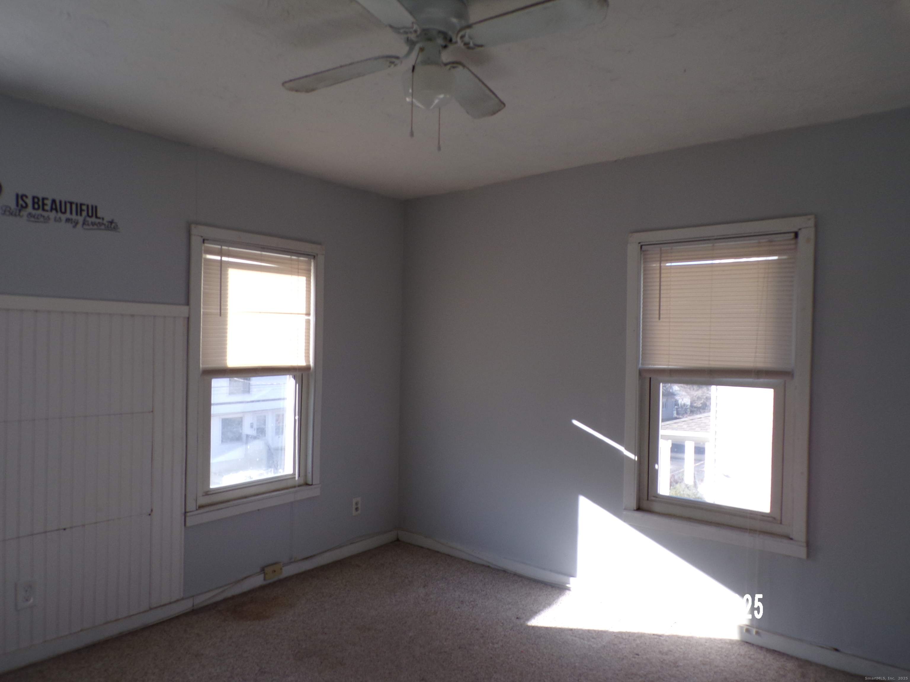 103 Myrtle Avenue Ansonia, CT 06401 - Photo 22 of 35 an empty room with a window and a ceiling fan