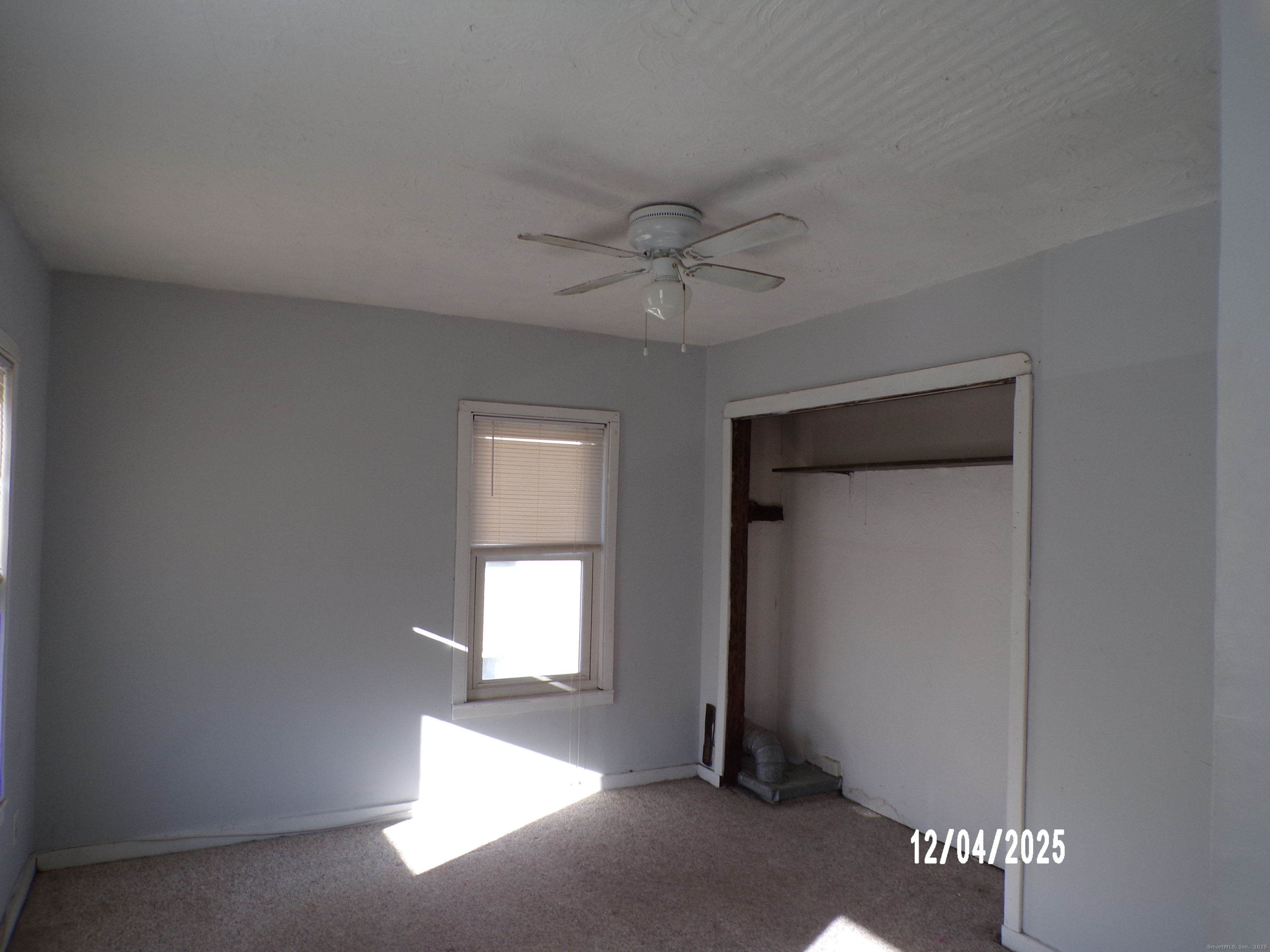 103 Myrtle Avenue Ansonia, CT 06401 - Photo 23 of 35 a view of a livingroom with a ceiling fan and window