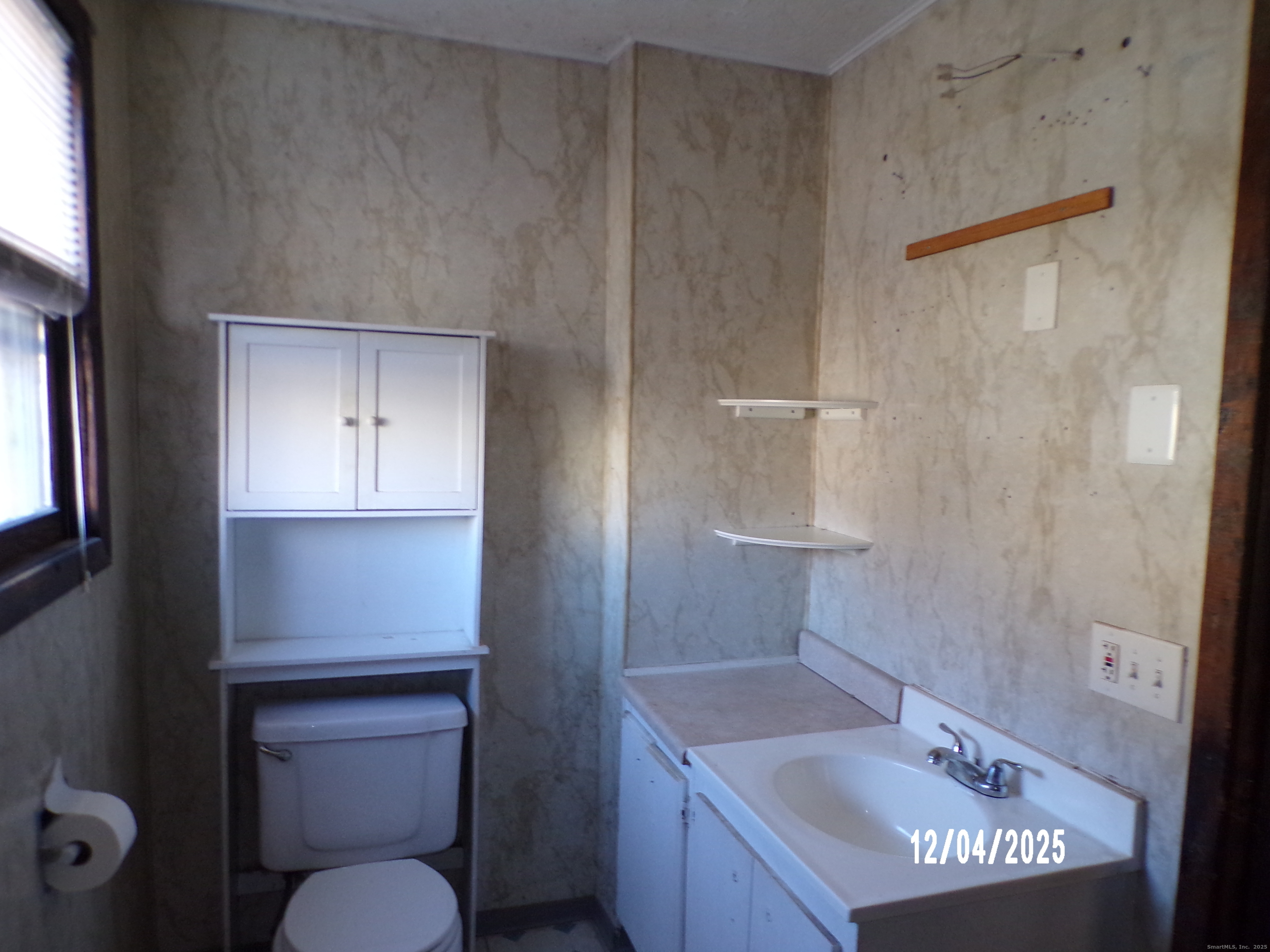 103 Myrtle Avenue Ansonia, CT 06401 - Photo 26 of 35 a bathroom with a sink a toilet and shower