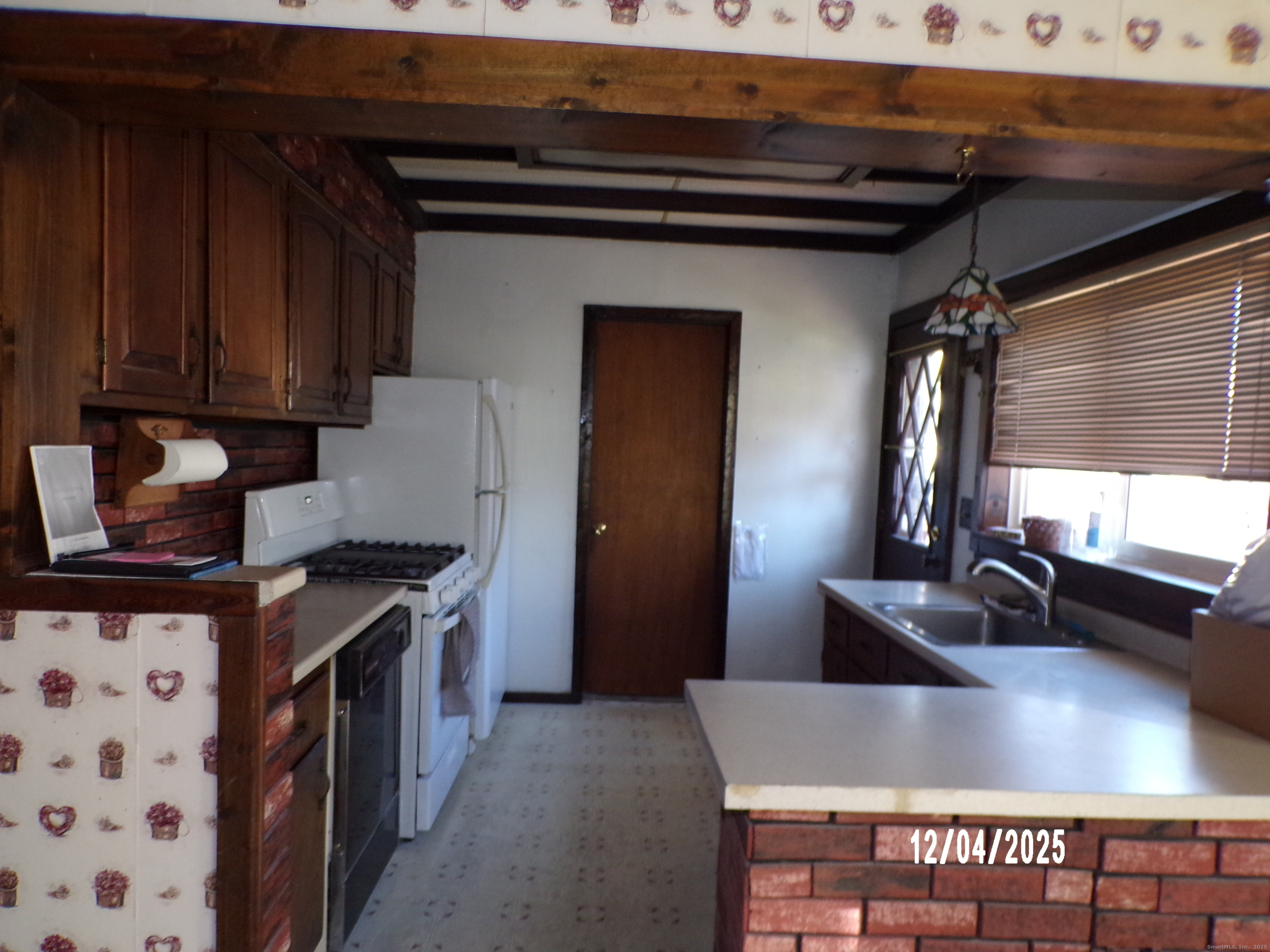 103 Myrtle Avenue Ansonia, CT 06401 - Photo 10 of 35 a kitchen with stainless steel appliances granite countertop a sink stove and cabinets
