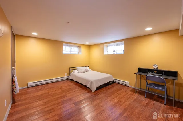 a room with wooden floor and furniture