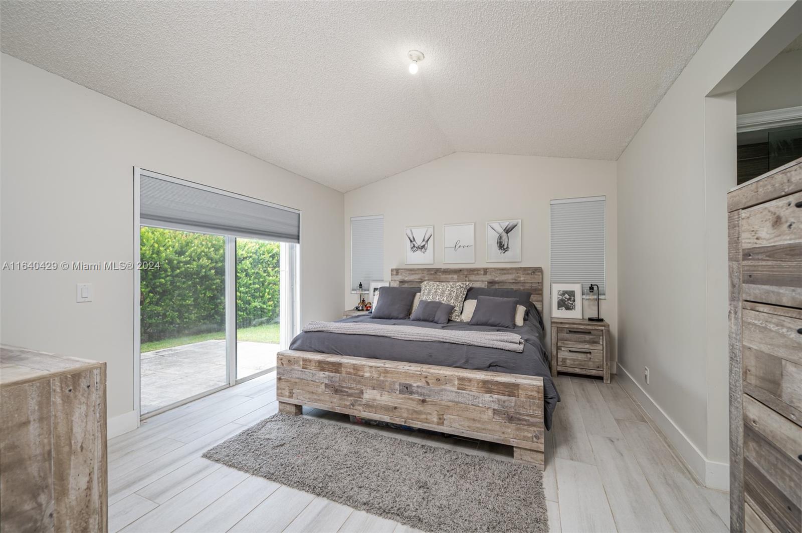 The Ridges Weston, FL 33331 - Photo 13 of 27 a bedroom with a bed and a large window