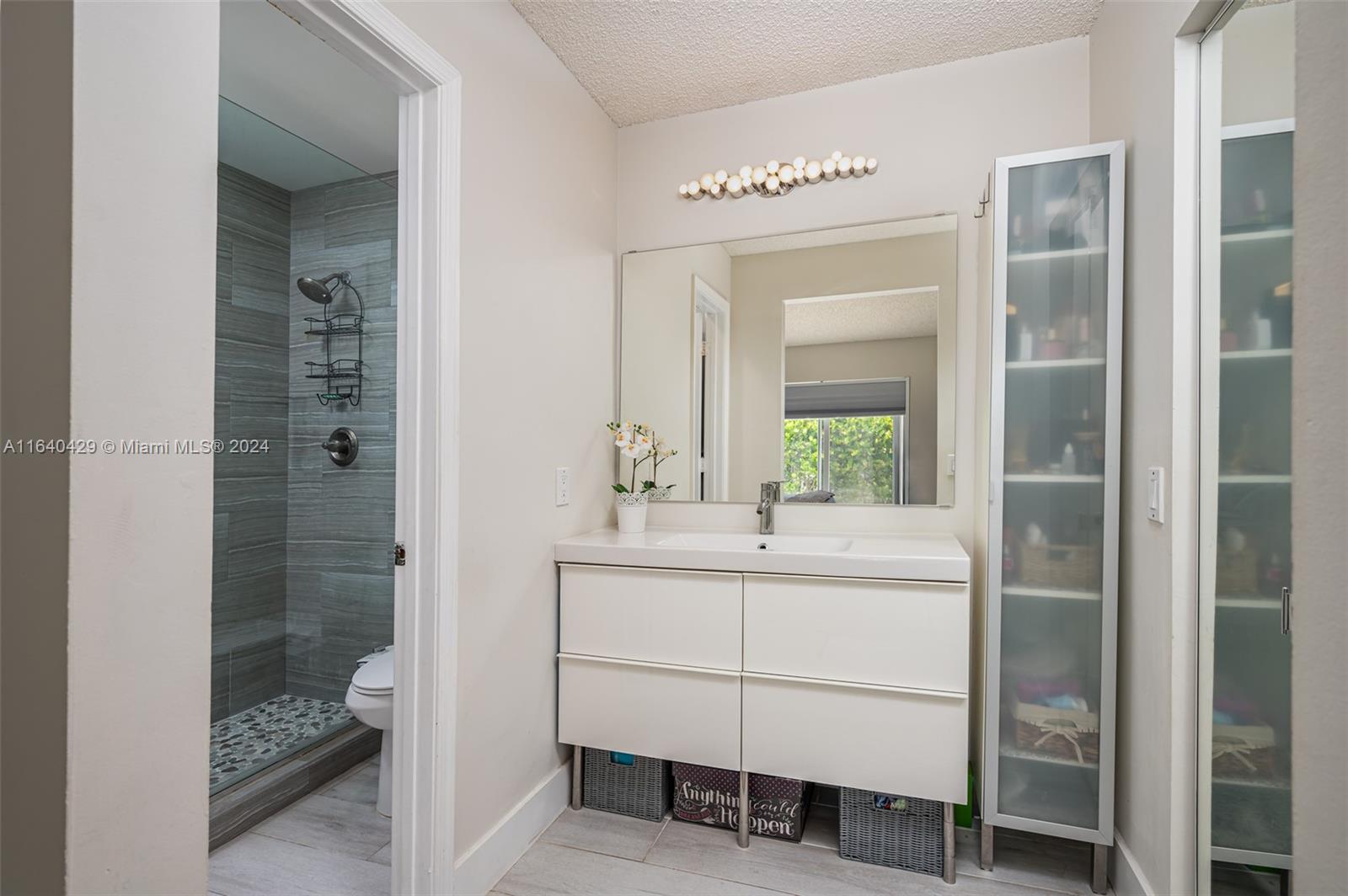 The Ridges Weston, FL 33331 - Photo 14 of 27 a bathroom with a sink a toilet and shower