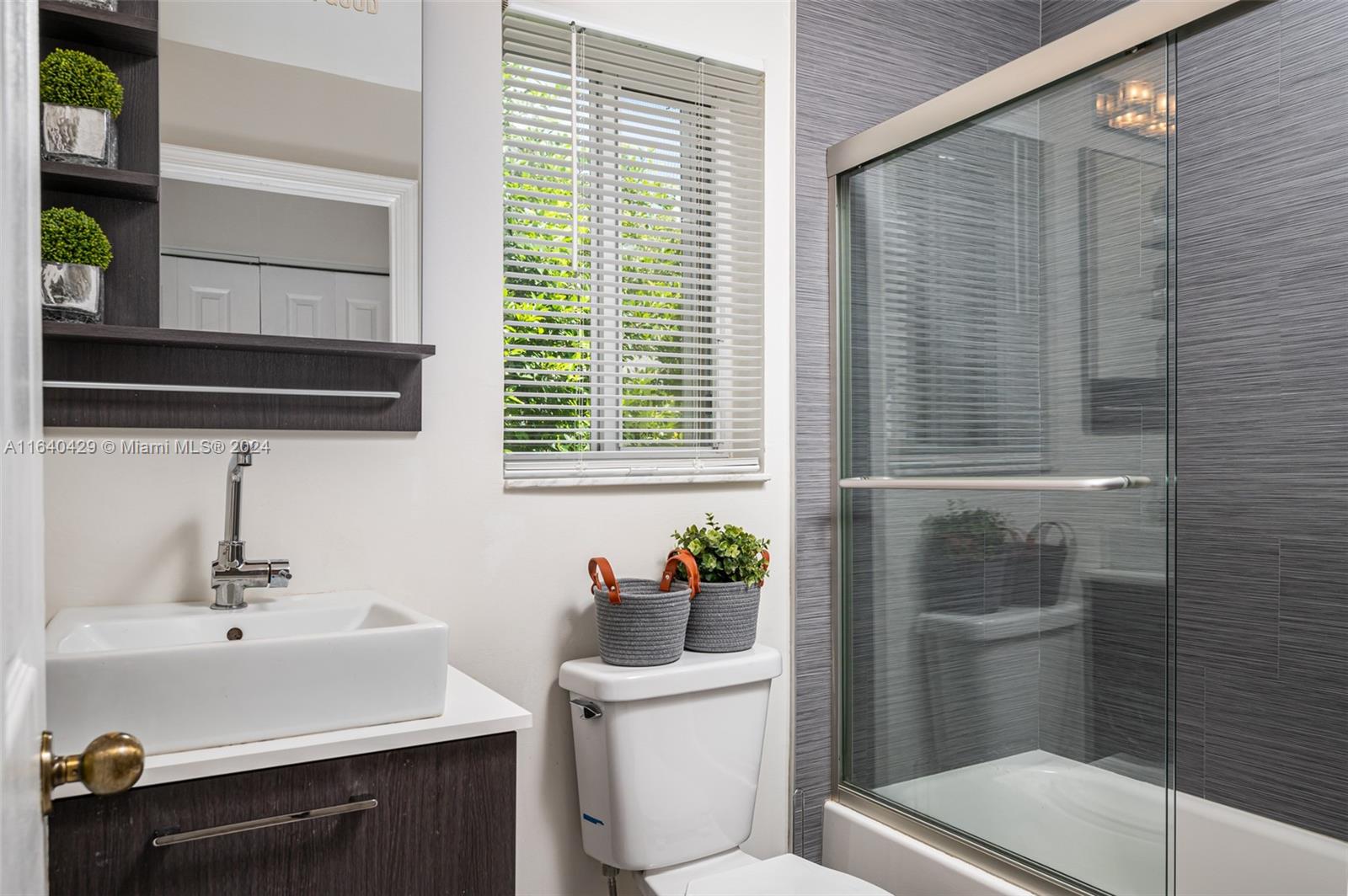 The Ridges Weston, FL 33331 - Photo 18 of 27 a bathroom with a sink a toilet and vanity