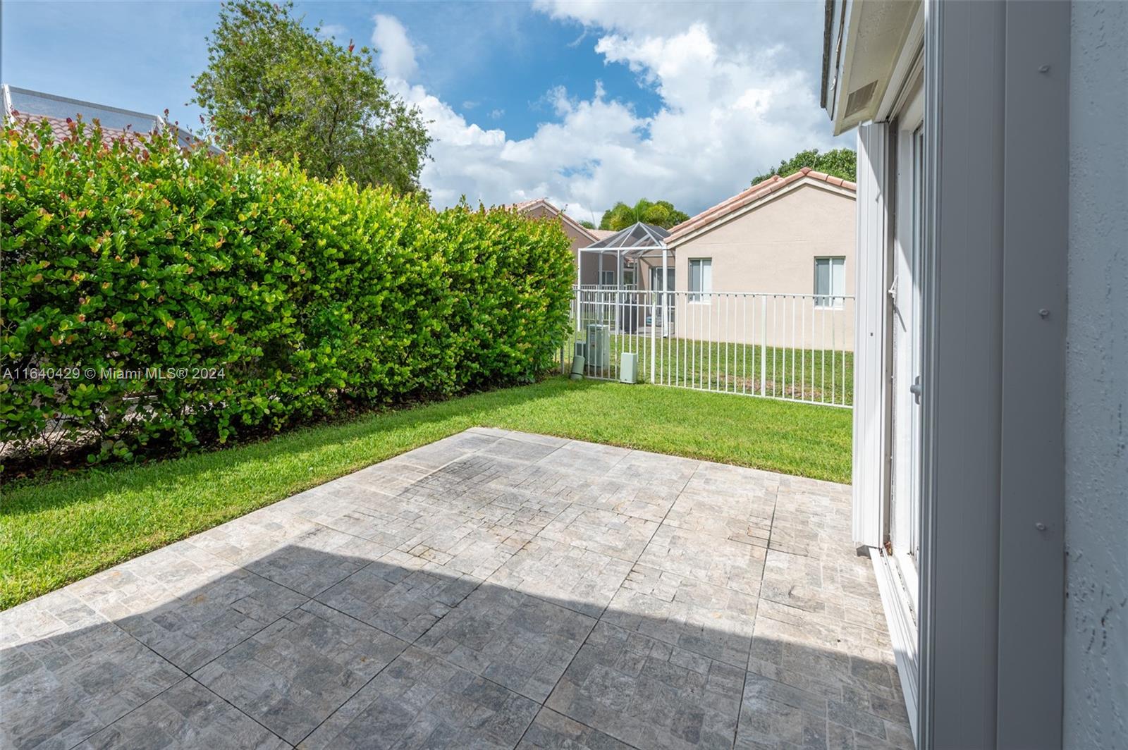 The Ridges Weston, FL 33331 - Photo 19 of 27 a view of a backyard with a garden and plants