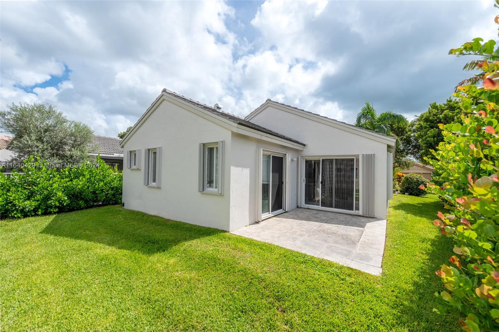 The Ridges Weston, FL 33331 - Photo 20 of 27 a view of an house with backyard and garden