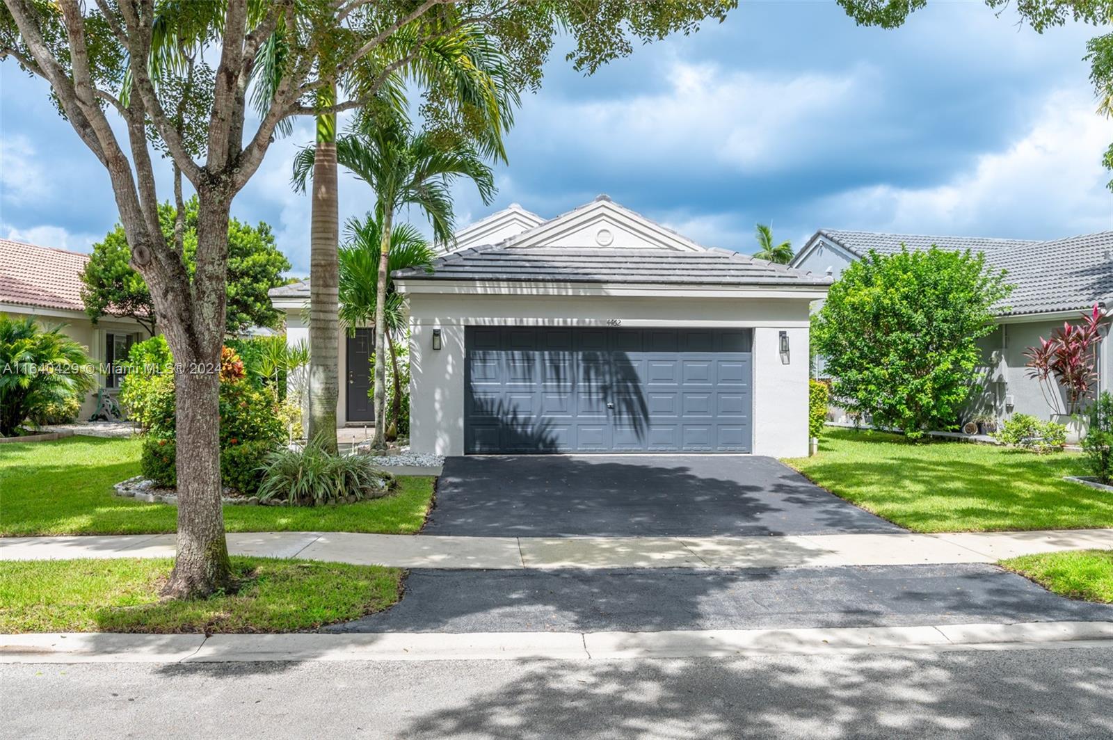 The Ridges Weston, FL 33331 - Photo 21 of 27 a front view of a house with garden