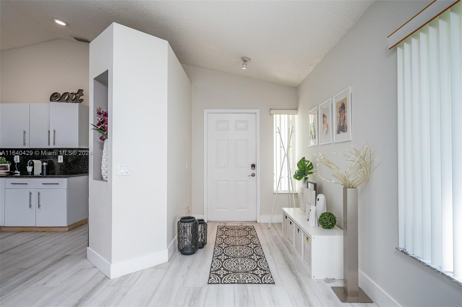 The Ridges Weston, FL 33331 - Photo 3 of 27 a room with furniture and wooden floor