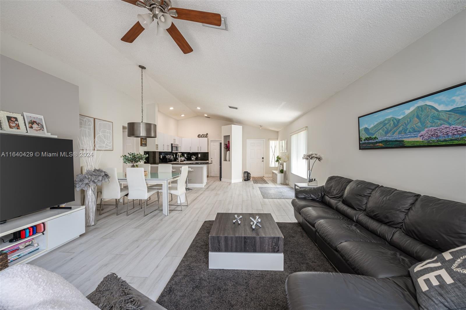 The Ridges Weston, FL 33331 - Photo 5 of 27 a living room with furniture and a flat screen tv