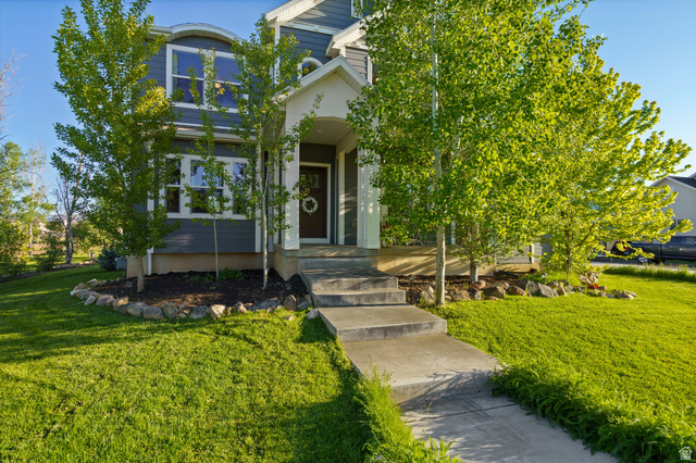 681 Island Road Morgan, UT 84050 - Photo 35 of 49 Two-story residential exterior with gray siding and white trim