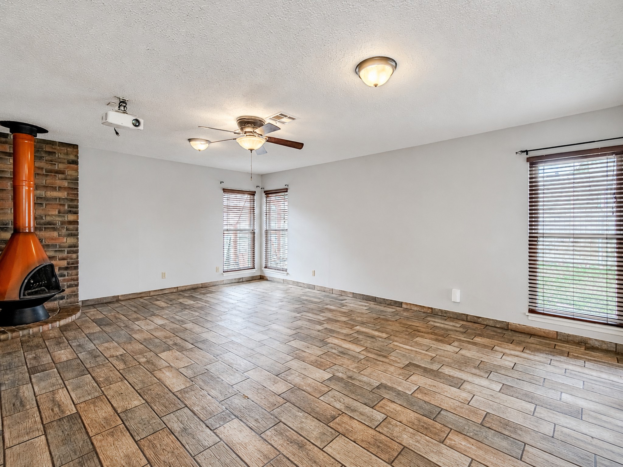 2710 Burke Road Pasadena, TX 77502 - Photo 17 of 38 Spacious den/flex space featuring a charming fireplace focal point
