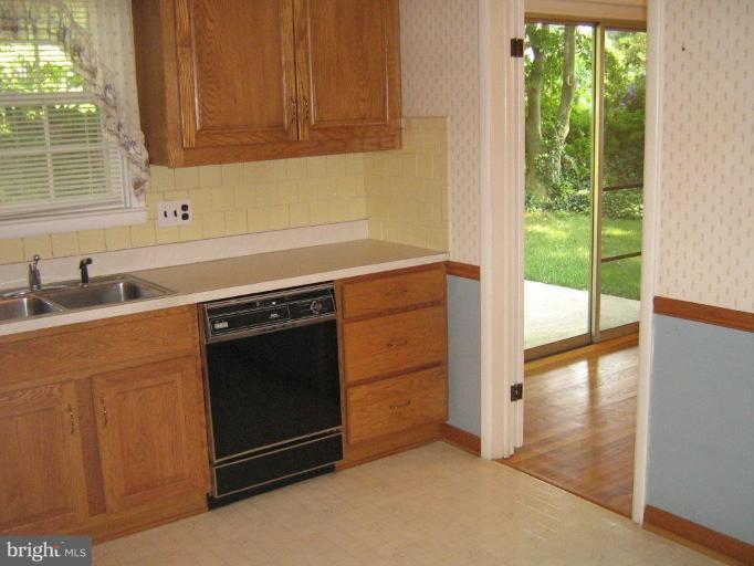 7103 Wardman Road Baltimore, MD 21212 - Photo 9 of 19 a kitchen with a stove and a sink
