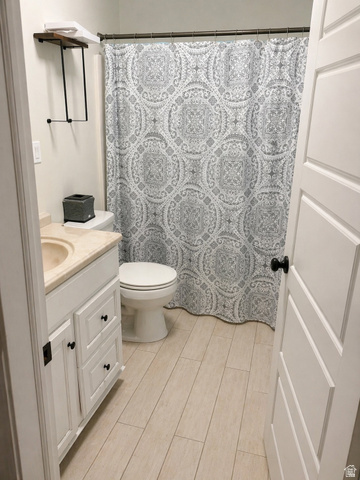 287 100 North Orem, UT 84057 - Photo 17 of 18 Full bathroom featuring vanity, curtained shower, and wood tiled floors