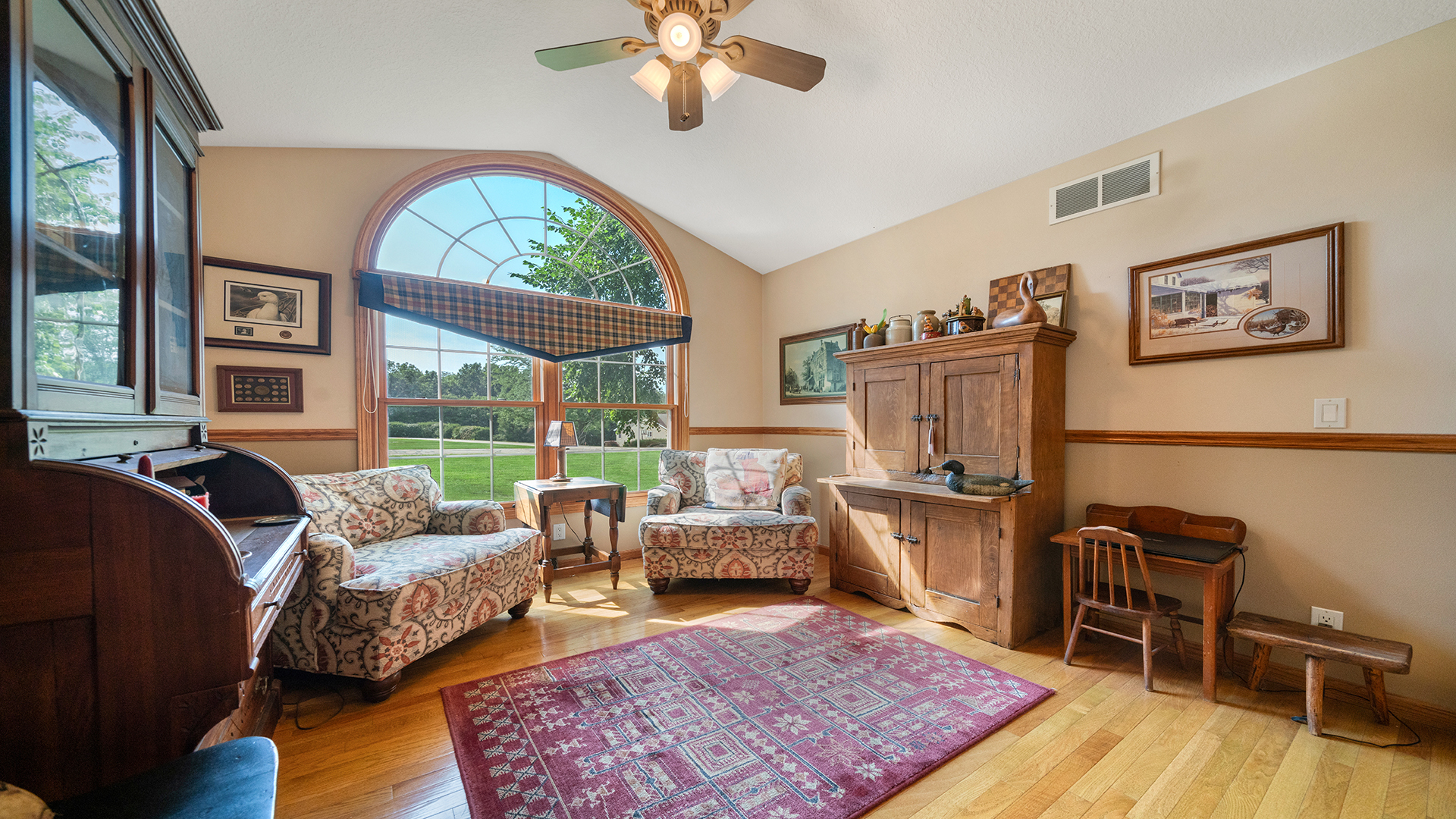 2162 Fawn Ridge Road Dixon, IL 61021 - Photo 25 of 53 a living room with furniture a fireplace and a floor to ceiling window