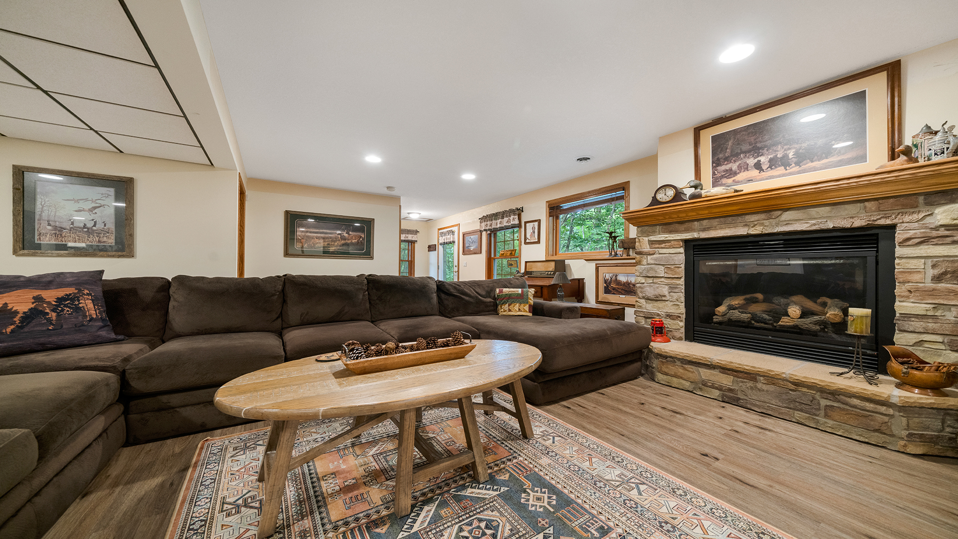 2162 Fawn Ridge Road Dixon, IL 61021 - Photo 28 of 53 a living room with furniture a flat screen tv and a fireplace