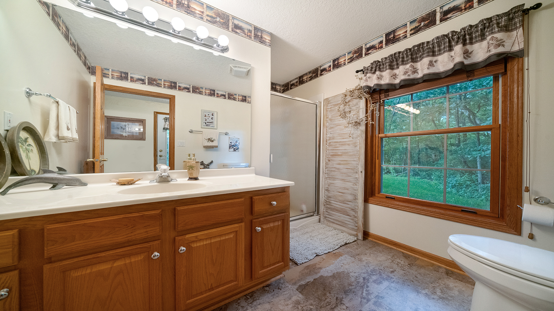 2162 Fawn Ridge Road Dixon, IL 61021 - Photo 42 of 53 a bathroom with a double vanity sink and a large mirror